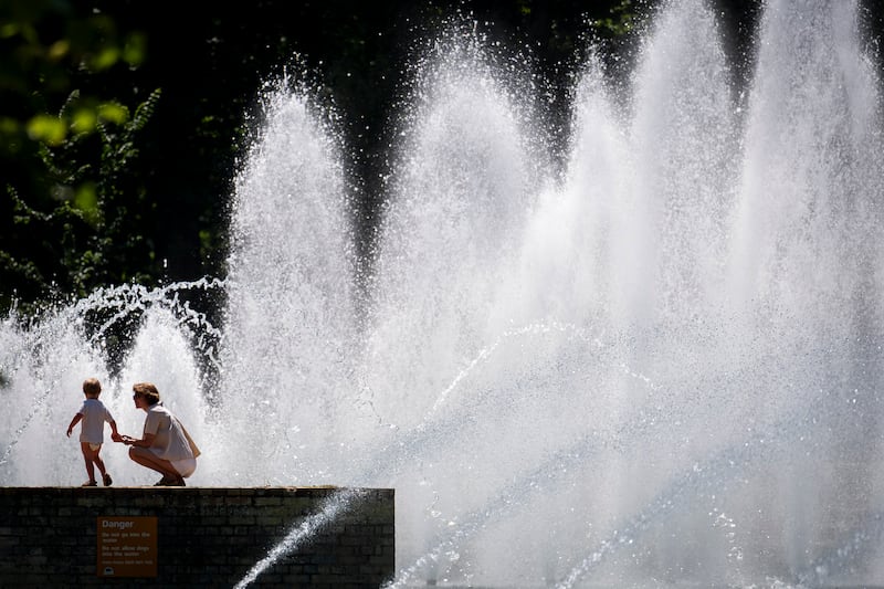 People enjoy the hot weather in Battersea Park, London on June 24th. Photo: Jordan Pettitt/PA 