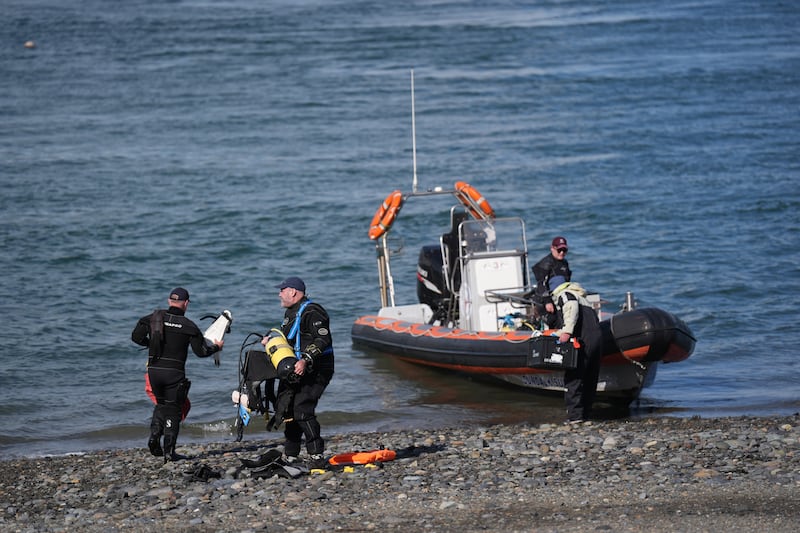 Members of Dundalk Sub Aqua search and rescue team prepare to join the rescue operation. Photograph: Niall Carson/PA Wire
