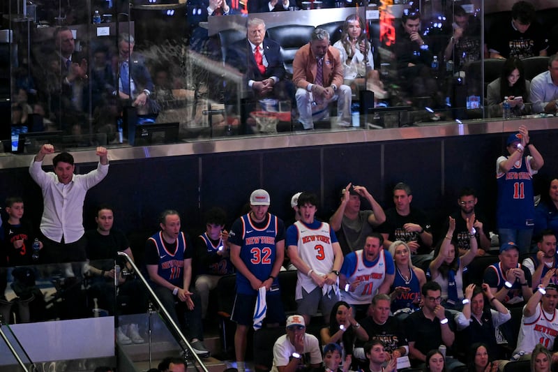 President Donald Trump sits next to Knicks owner James Dolan  as they attend game three of the NBA Finals between the San Antonio Spurs and the New York Knicks at Madison Square Garden in New York. Photograph: SAUL LOEB/AFP via Getty Images