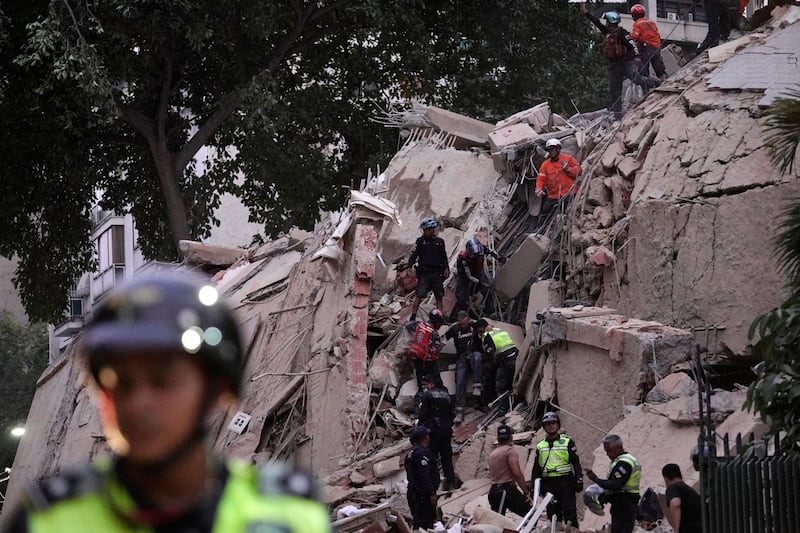 Rescue workers evacuate an injured person from a collapsed building following an earthquake in Caracas. Photograph: Manaure Quintero/AFP via Getty Images
