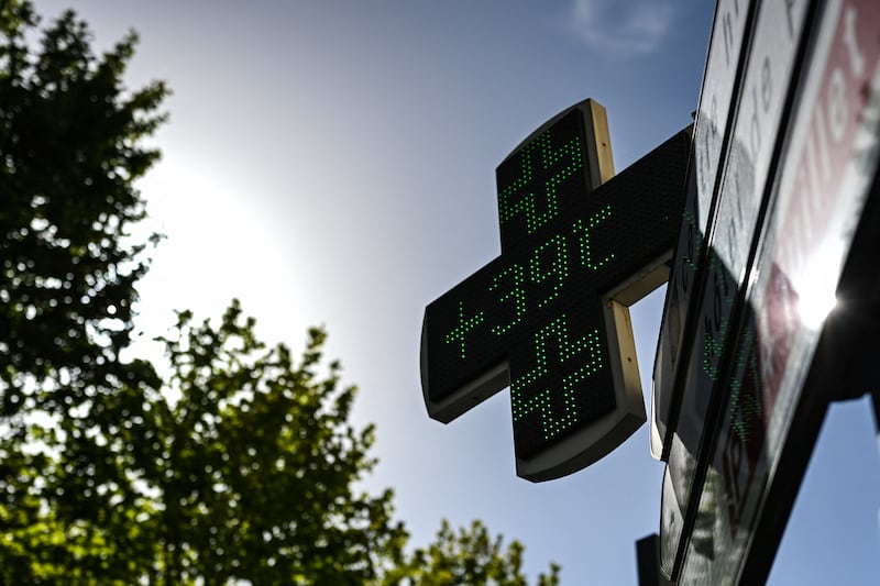 A pharmacy sign displays the temperature in Beziers, southern France. Photograph:  Gabriel Bouys/AFP/Getty Images