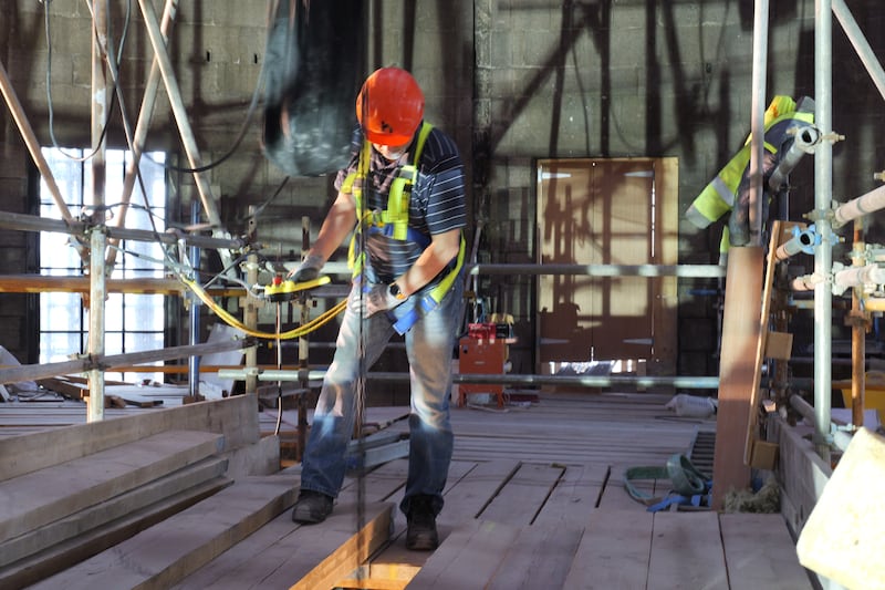 Four Courts restoration: a capital is hoisted to the top of the building. Photograph: OPW