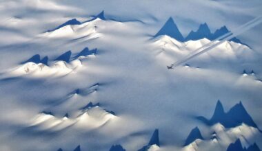 An aerial view of the snowy landscape of Antarctica.