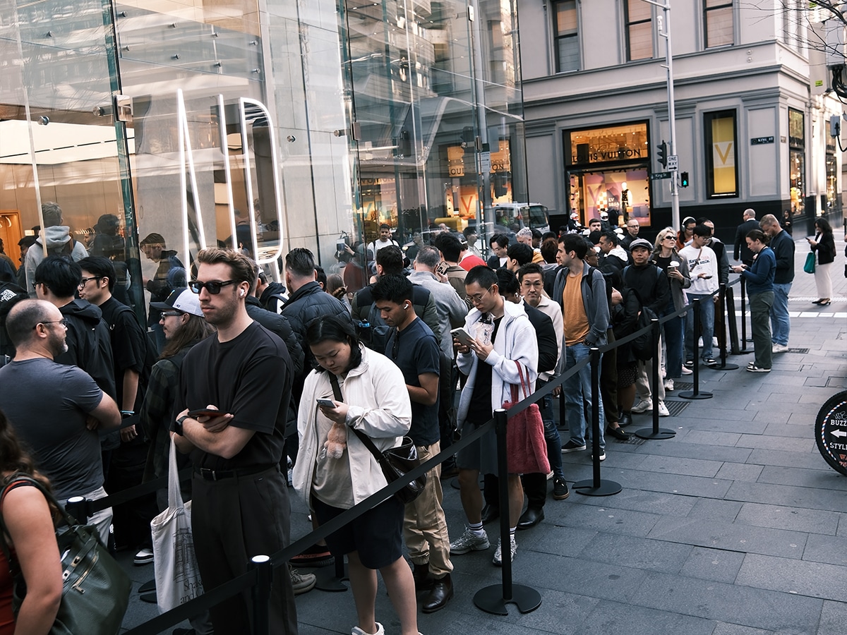 Customers line up outside an Apple Store in Sydney, eagerly waiting to purchase the new iPhone 17.
