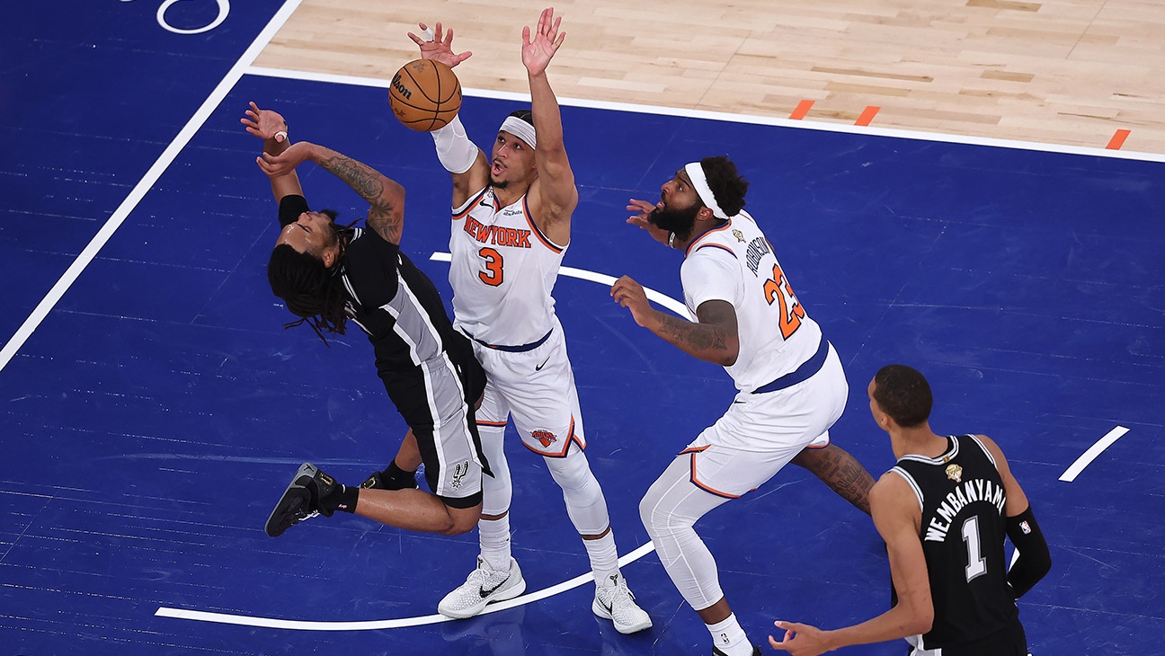 Stephon Castle #5 of the San Antonio Spurs shoots the ball against Josh Hart #3 of the New York Knicks on the final play of the fourth quarter in Game Four of the 2026 NBA Finals at Madison Square Garden on June 10, 2026 in New York City.