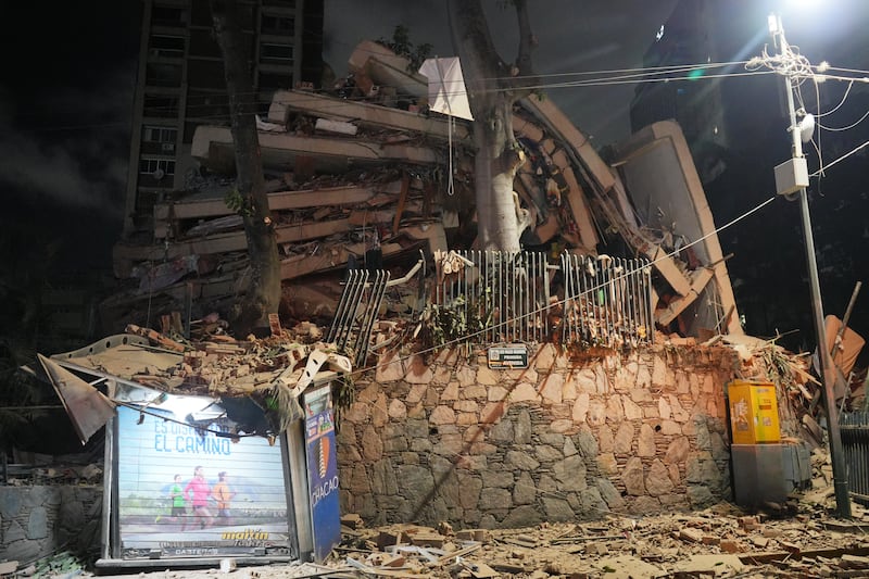 A collapsed building in Caracas. Photograph: Adrian Naranjo/AP