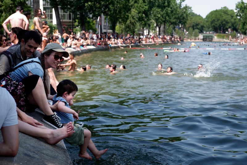 Parisians swimming in the Canal Saint-Martin during the heatwave in the city of Paris on Saturday. Photogra[h: Brune Simon/Hans Lucas / AFP via Getty Images