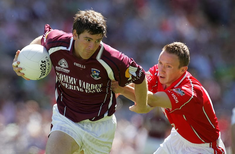 Paul Clancy playing for Galway against John Hayes of Cork. Photograph: Lorraine O'Sullivan/Inpho