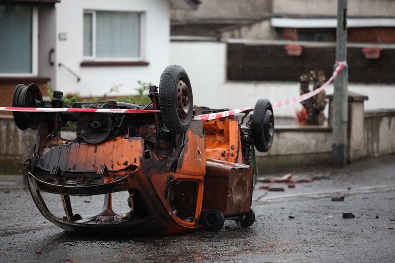 A burned-out vehicle after a night of violent disorder on Antrim Road in Newtownabbey, Northern Ireland, on Thursday. Photograph: Adam Vaughan/EPA