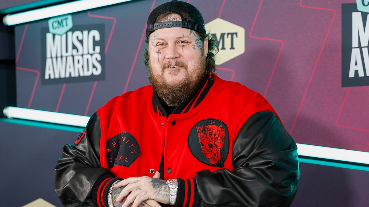 Jelly Roll standing on the red carpet at the CMT Music Awards in Austin, Texas.