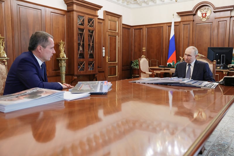 Vyacheslav Gladkov (left, at a meeting with Vladimir Putin), then the governor of the Russian border region of Belgorod, warned last year that the ability to use Telegram was a matter of life and death, as it was used to track incoming attacks. Photograph: Mikhail Metzel/AFP/Getty