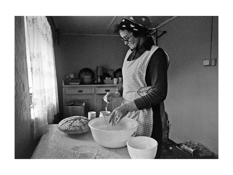 Mary Denis baking bread in the kitchen of her cottage at West Town, Tory Island, in 1977. Photograph: Eric Luke