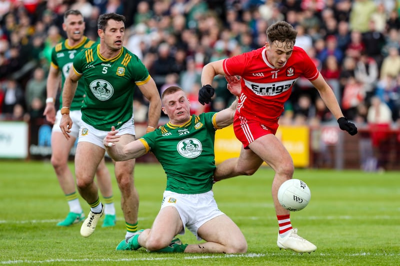 Derry’s James Sargent on his way to scoring a goal despite Meath’s Jack Flynn. Photograph: Lorcan Doherty/Inpho