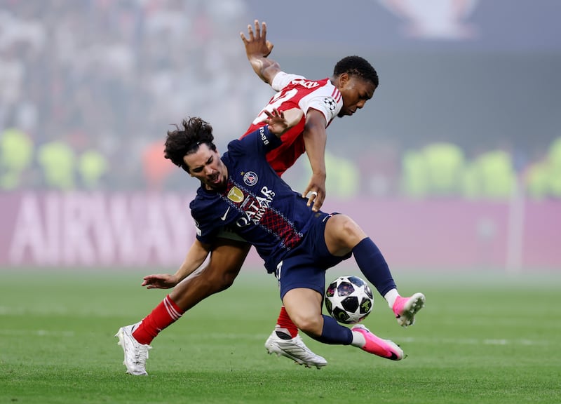 Vitinha of Paris Saint-Germain is challenged by Myles Lewis-Skelly of Arsenal during the UEFA Champions League final. Photograph: Carl Recine/Getty Images