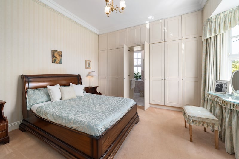 Principal bedroom with discreetly hidden en suite
