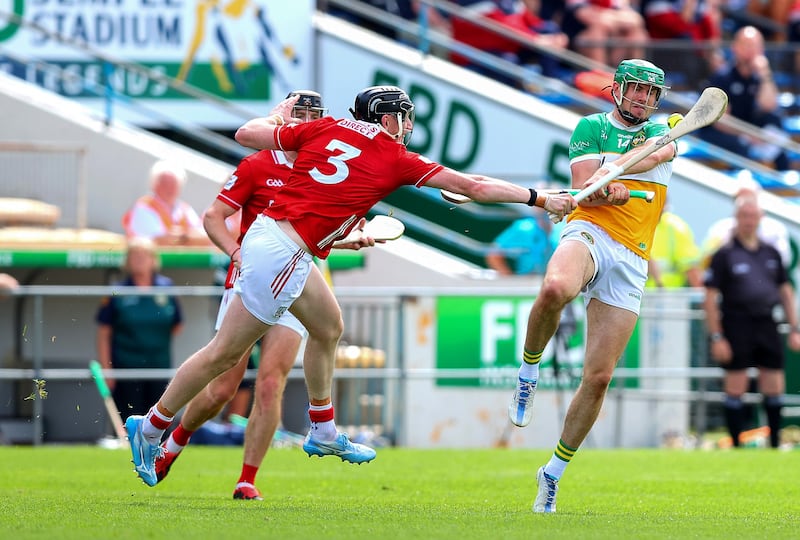 Offaly's Brian Duignan is blocked down by Cork's Damien Cahalane. Photograph: Tom O'Hanlon/Inpho