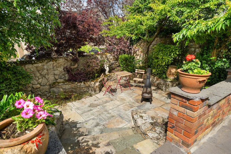 Cosy paved nook in the rear garden