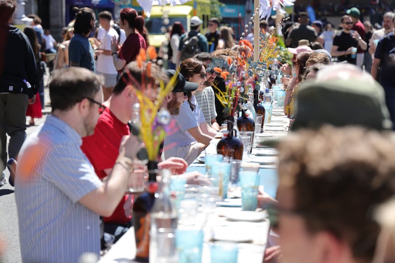 njoying outdoor lunch at the 'Long Table' event a highlight of the Stoneybatter Festival.  Photo: Bryan O’Brien / The Irish Times