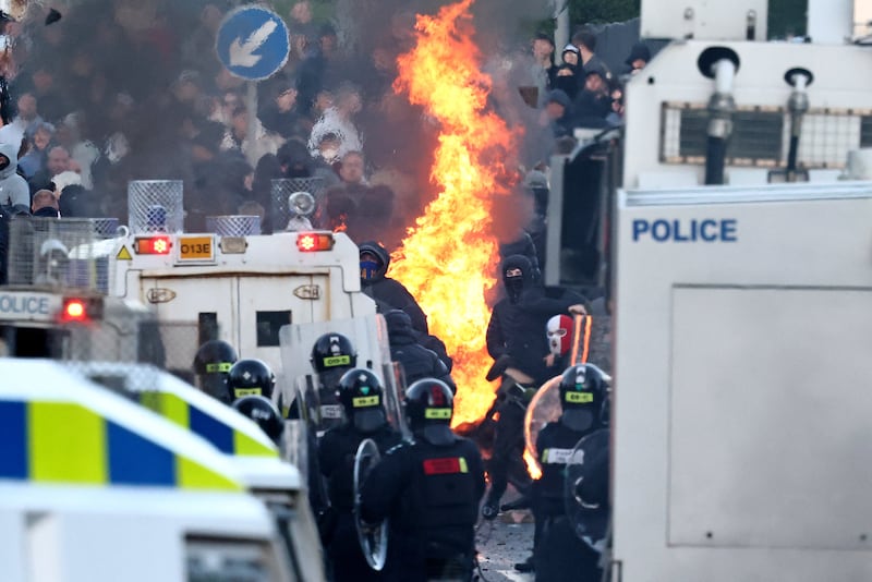 Protesters clash with police block their way to a hotel previously believed to house migrants, in Glengormley, north of Belfast. Photograph: Henry Nicholls/AFP via Getty Images