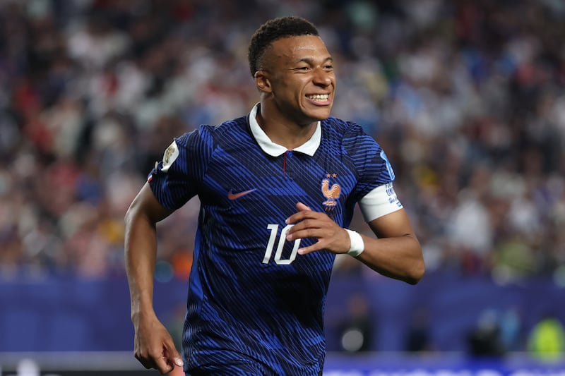 All smiles for Kylian Mbappé, who has helped confirm France's progress to the last 32 of the World Cup already. Photograph: Dan Mullan/Getty Images