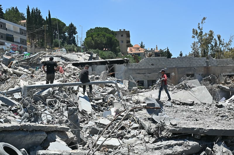 Residents arrive to inspect what is left of their homes and businesses, destroyed in Israeli military strikes, in the southern Lebanese village of Srifa on June 24, 2026. Photograph: Fadel Itani/AFP via Getty Images