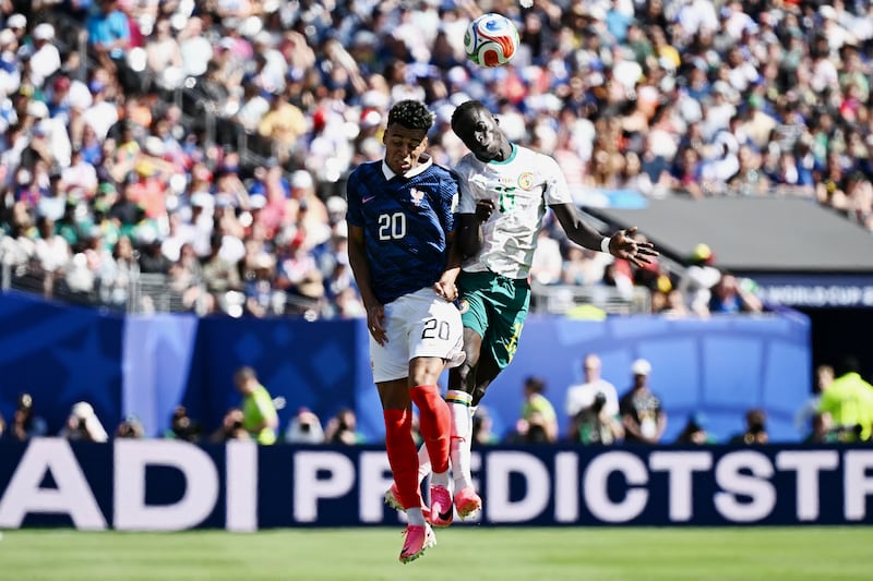 France's Désiré Doué and Senegal's Krepin Diatta fight for the ball. Photograph: Jewel Samad/AFP via Getty Images