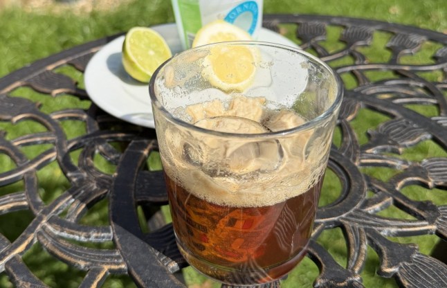 A closer look at the Espresso Bomb in a glass, with lime wedges and salt behind it