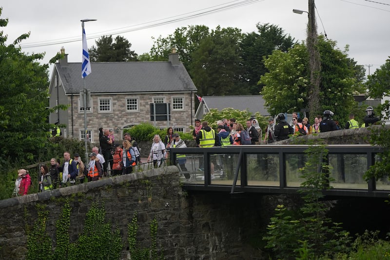 A pro-Palestinian march under protection of  PSNI officers passes closes the village of Scarva, Co Down, as it heads from Lurgan to Newry. Photograph: Niall Carson/PA Wire