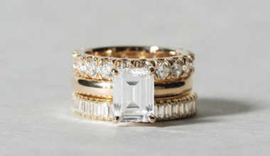 an engagement ring with multiple diamond wedding bands layered