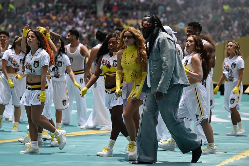 Shakira and Burna Boy perform during the opening ceremony. Photo: Carl De Souza/AFP/Getty