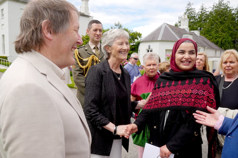 President Catherine Connolly and her husband Brian McEnery chatting with guests during her first presidential garden party. Photograph: Brian Lawless/PA Wire