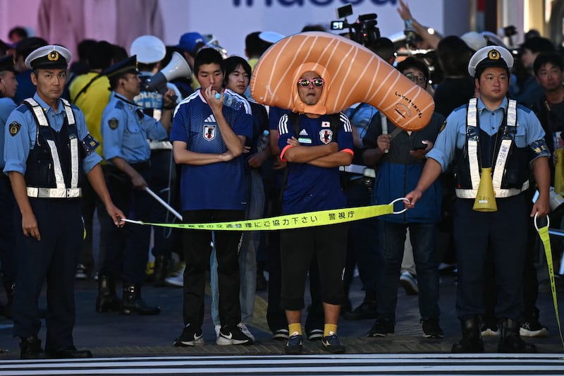 Japanese fans in Tokyo react after watching their team's World Cup loss to Brazil. Photograph: Philip FONG/AFP via Getty Images