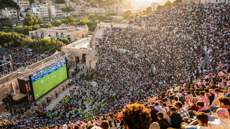 Fans watch Jordan play Algeria on a big screen at the Roman Theatre of Amman. Photograph: George Saif/AFP via Getty Images