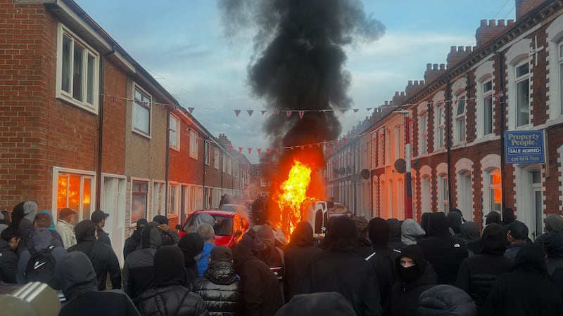 Vehicles set on fire by protesters on Lendrick Street in Belfast, as disorder flared in response. Photograph: PA