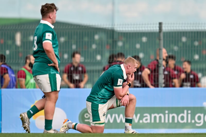 Ireland's Dylan McNeice dejected after the defeat to England. Photograph: Levan Verdzeuli/Inpho
