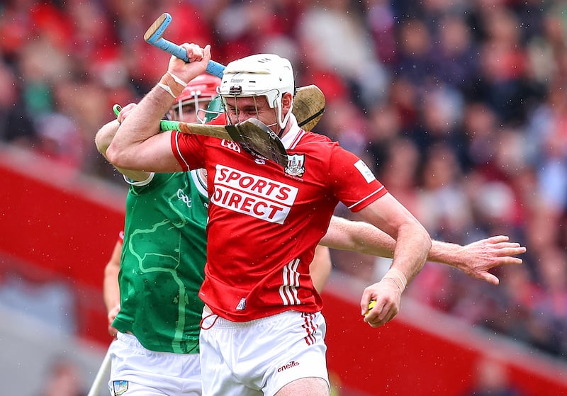 Cork's Tim O'Mahony with William O'Donoghue of Limerick. Photograph: Tom O’Hanlon/©INPHO