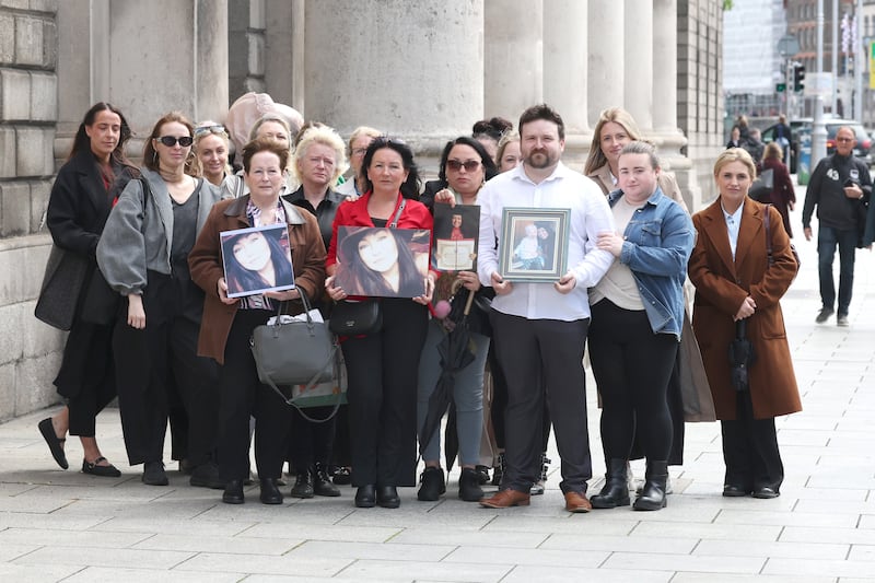 Family and friends hold photos of Maxine Maguire, who died by suicide. Photograph: Collins Courts