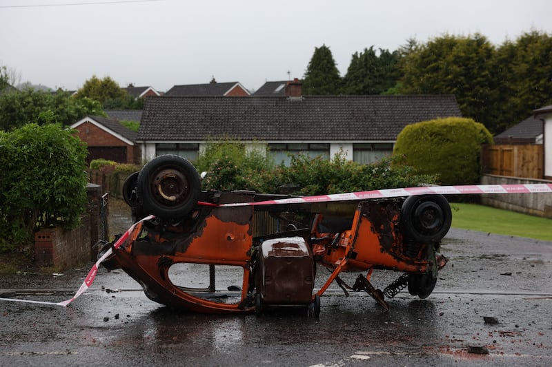 A burned-out vehicle after a night of violent disorder on Antrim Road in Newtownabbey, Northern Ireland, on Thursday. Photograph: Adam Vaughan/EPA