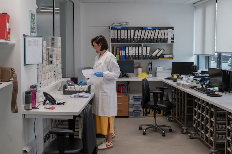 A staff member working in the reception laboratory at the NCSL. Photograph: Paulo Nunes dos Santos
