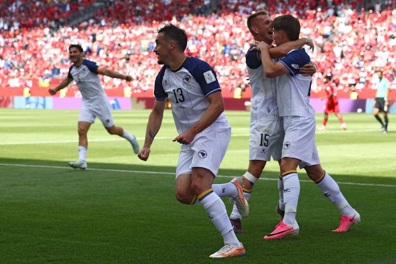 Bosnia-Herzegovina's players celebrateJovo Lukic's opening goal. Photograph: Cole Burston/AFP via Getty Images