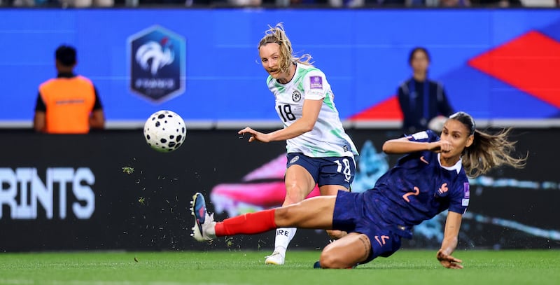 Ireland's Kyra Carusa shoots under pressure from Maëlle Lakrar of France. Photograph: Ben Brady/Inpho