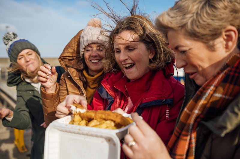 A big bag of chips covered in salt and vinegar on a summer’s evening can make for a memorable dinner. Photo: Getty Images