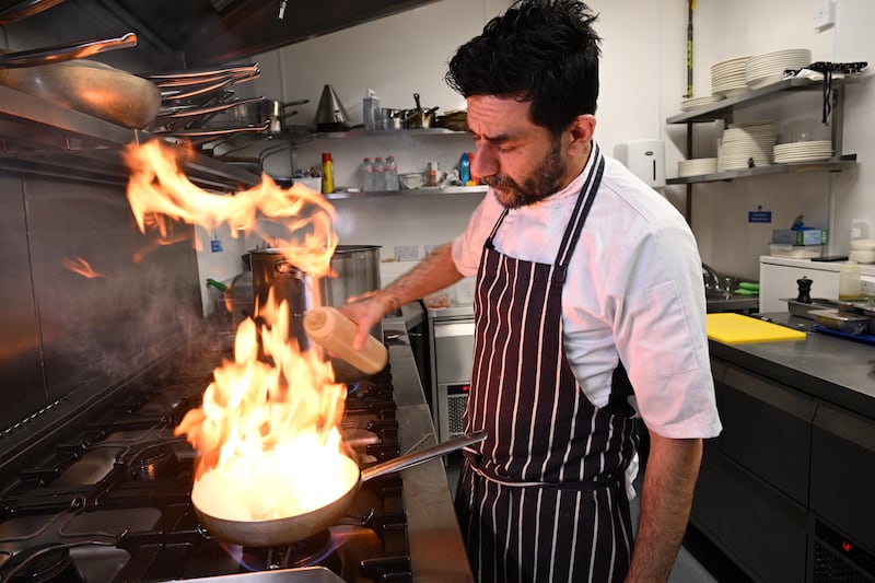 La Vespa head chef Paolo Orlando preparing linguine. Photograph: Bryan Meade 