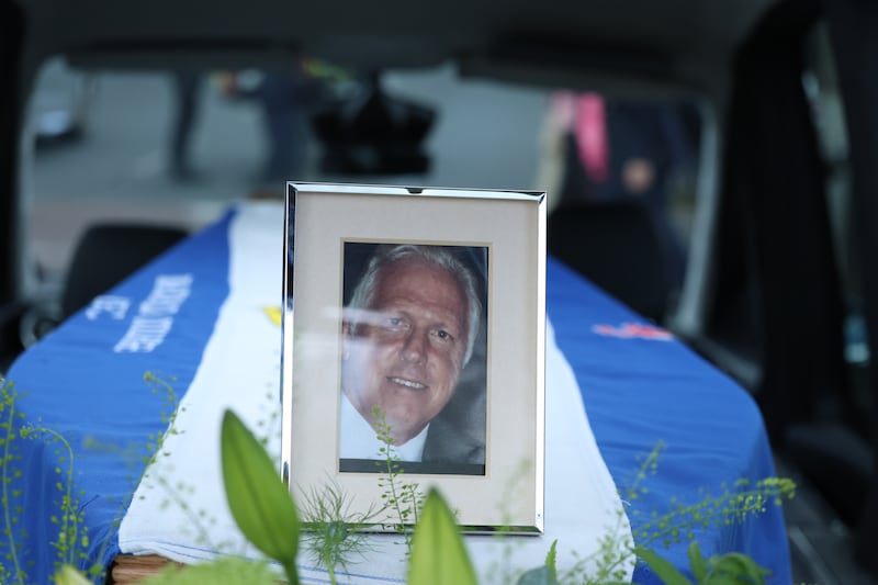 A photo of Fergus Slattery sits on top of his coffin at St Joseph’s Church, Glasthule. Photograph: Stephen Collins/Collins Photos
