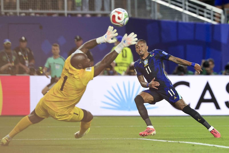 Brazil forward Raphinha (R) puts the ball past Haiti goalkeeper Johnny Placide, but the goal was disallowed because Raphinha was offside. Photograph: EPA