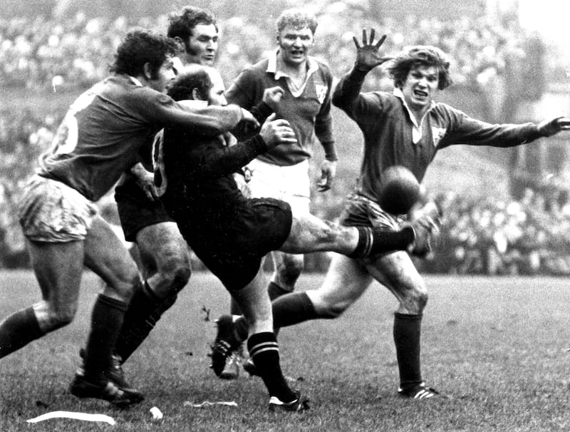New Zealand scrum-half Sid Going gets in his kick despite the attentions of Sean Lynch and Fergus Slattery in Lansdowne Road, 1973.  Photograph: Dermot O'Shea/The Irish Times