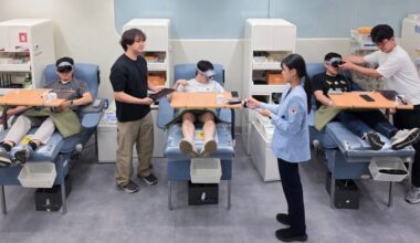 People giving blood while wearing a Samsung Galaxy XR headset