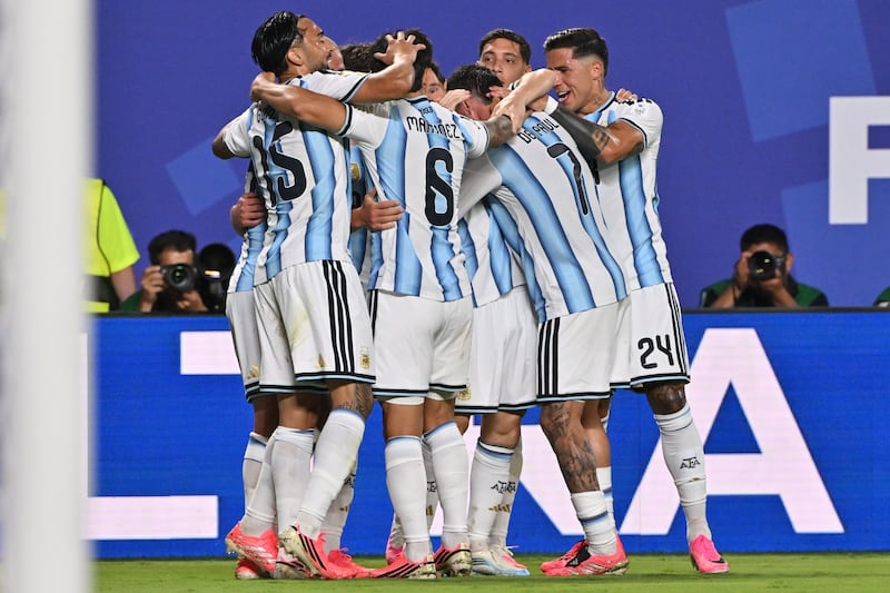 Argentina players celebrate their second goal against Algeria. Photograph: EPA