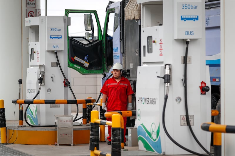 A worker refuels a truck at a hydrogen refueling station during a media tour at the Daxing International Hydrogen Energy Demonstration Zone in Beijing, China. Photograph: EPA