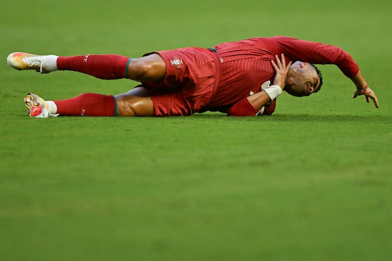 Cristiano Ronaldo gestures on the ground during the 2026 World Cup football match between Colombia and Portugal at the Miami Stadium in Miami Gardens on June 27, 2026.  Photograph: Chandan Khanna/AFP via Getty Images